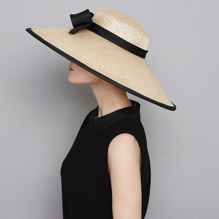 Large natural fine straw bell with black edge and bow