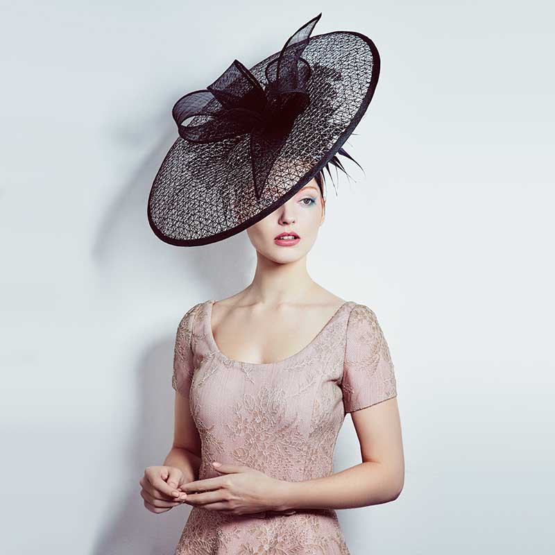 Large black mesh disc with bows and feathers