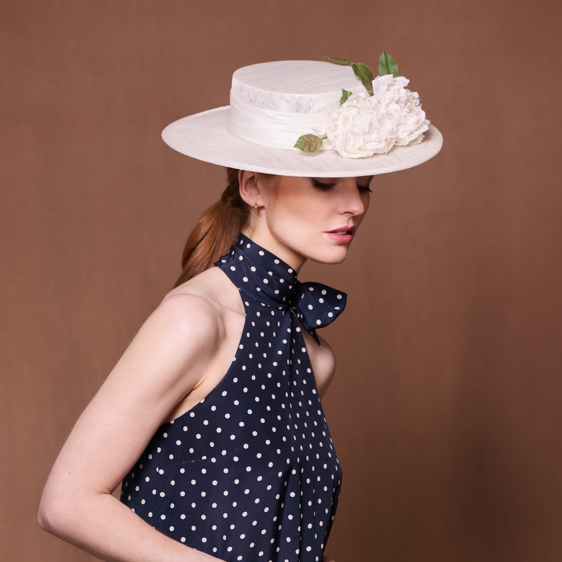 White fine straw boater with silk roses