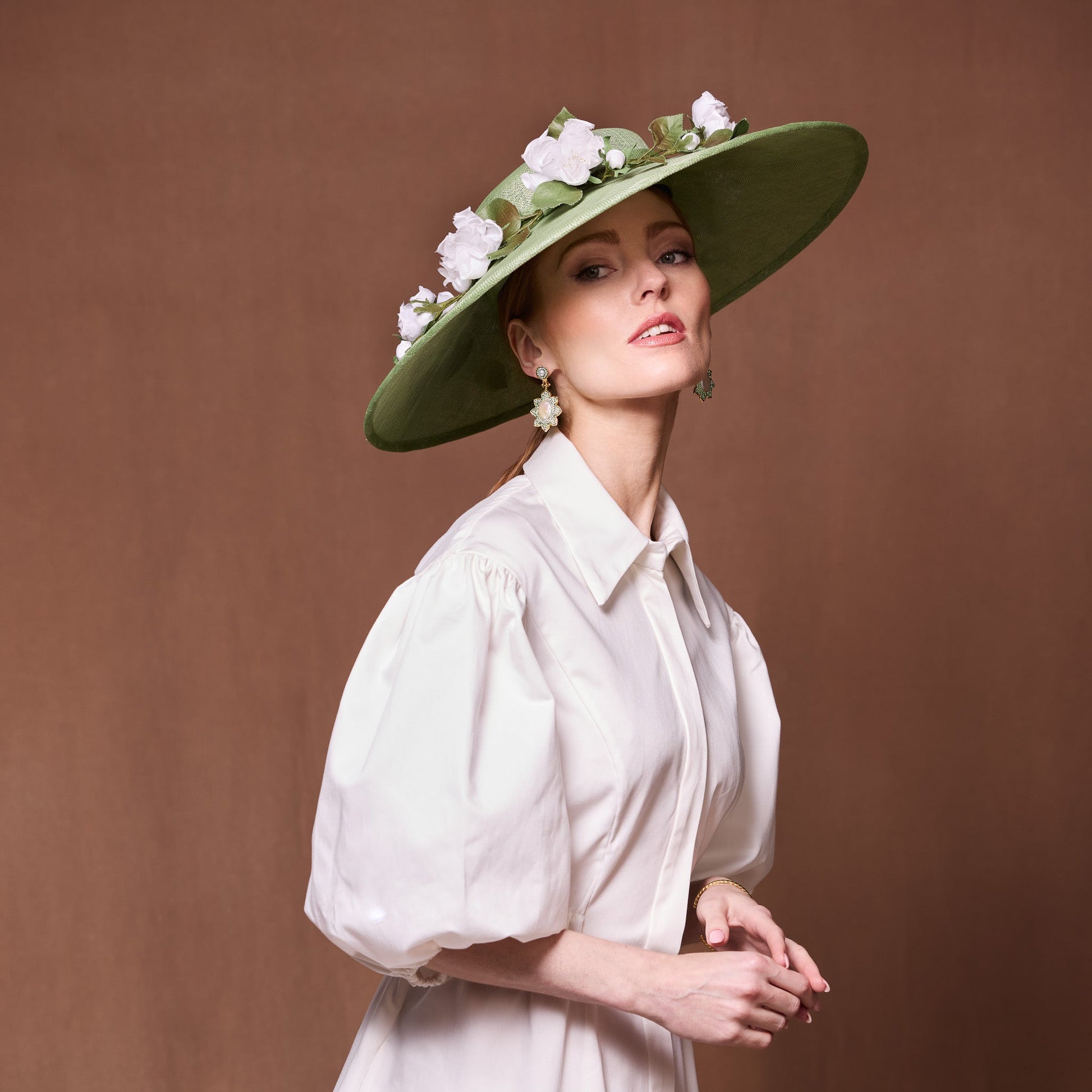 Soft green fine straw cut through with organza flowers