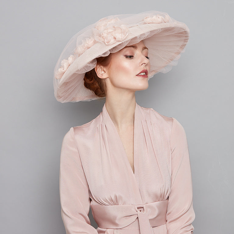 Pale pink tulle covered bell with silk flowers
